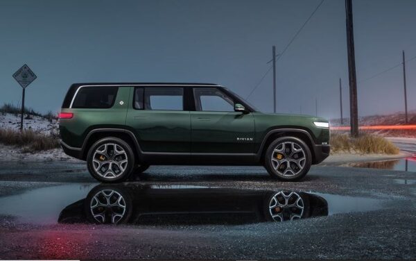 1st Generation Rivian R1S electric SUV three seated clear side view