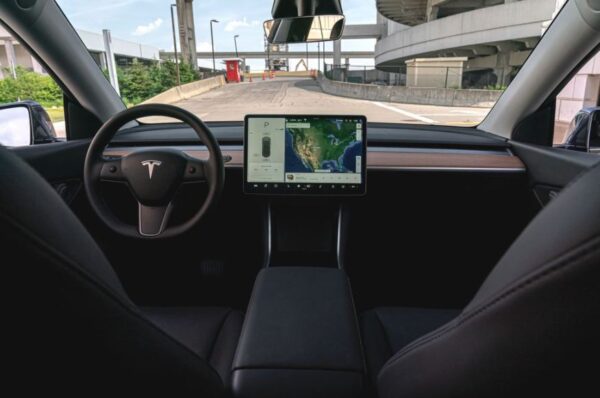 Tesla Model Y Smart SUV infotainment screena and steering wheel view