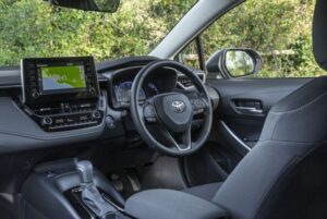 12th Generation Toyota Corolla Hybrid Sedan steering wheel and infotainment screen