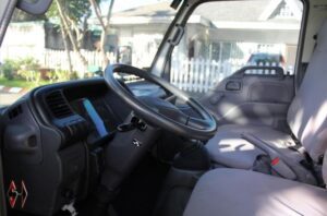 6th generation isuzu NHR pickup truck cabin interior 2