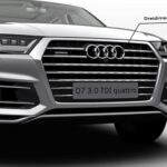 2nd Generation audi Q7 SUV headlamps and grille close view