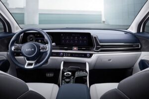 5th generation kia sportage suv steering wheel and infotainment screen view