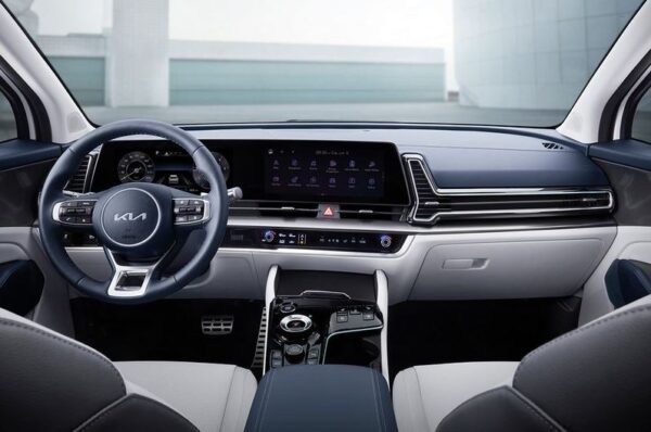 5th generation kia sportage suv steering wheel and infotainment screen view