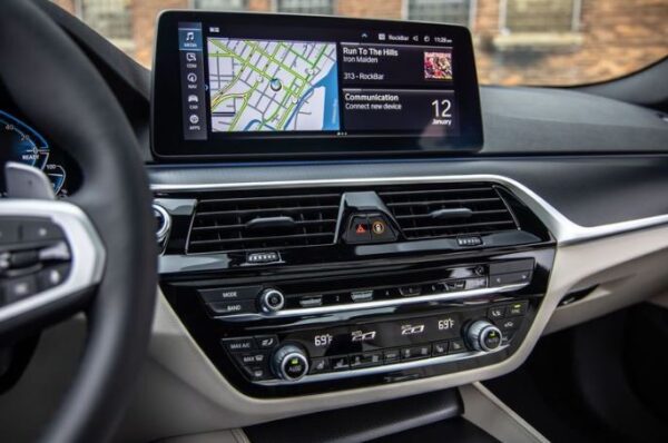 BMW 5 series sedan 7th Generation infotainment screen air vents and controls view