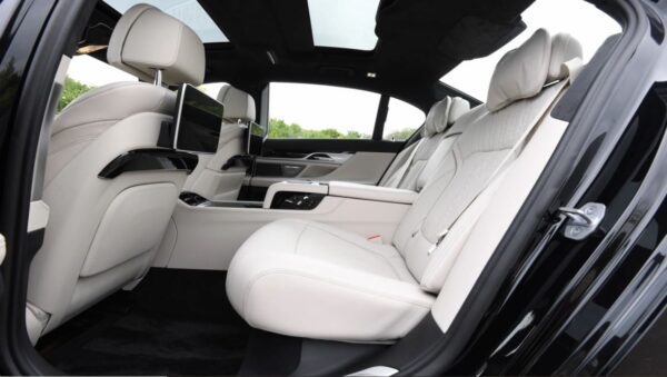 BMW 7 Series sedan 6th Generation white interior rear seats view
