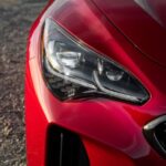 Kia stinger sedan Refreshed 1st generation red headlamp view