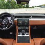 Jaguar f pace suv 1st generation steering wheel and infotainment screen view