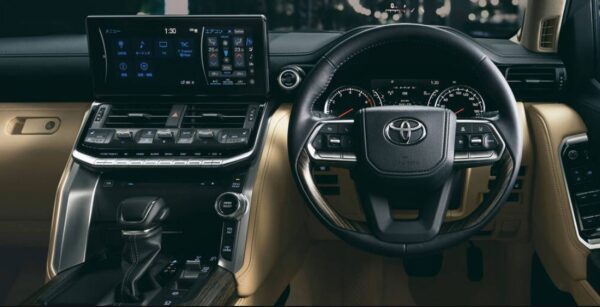 Toyota Land Cruiser SUV J300 Series steering wheel and infotainment screen view