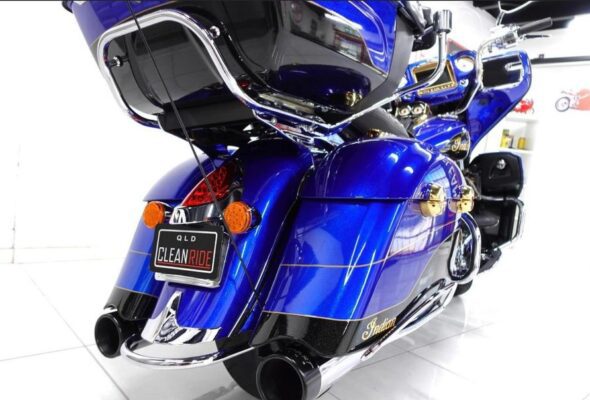 Indian Roadmaster heavy faired cruiser motorcycle blue full rear view
