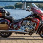 Indian Roadmaster heavy faired cruiser motorcycle red full side view