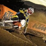 ktm 125 SX off road sports motorcycle driving in the mud