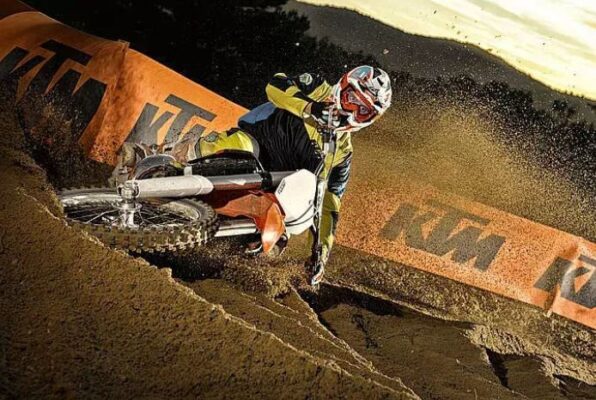 ktm 125 SX off road sports motorcycle driving in the mud