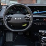 Kia EV6 four door wagon 1st gen steering and infotainment screen view
