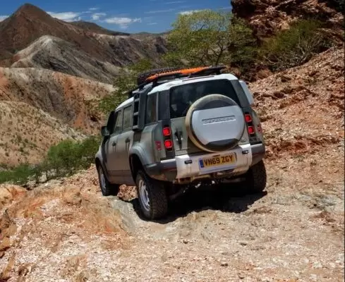 Latest generation Land Rover Defender SUV full rear view