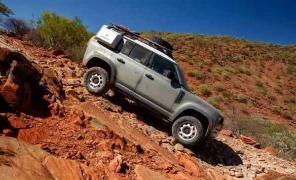 Latest generation Land Rover Defender SUV moving downward